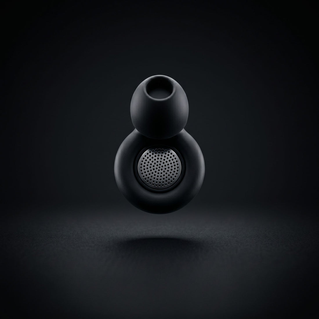 earplugs case and earplugs float mid air on dark background 
