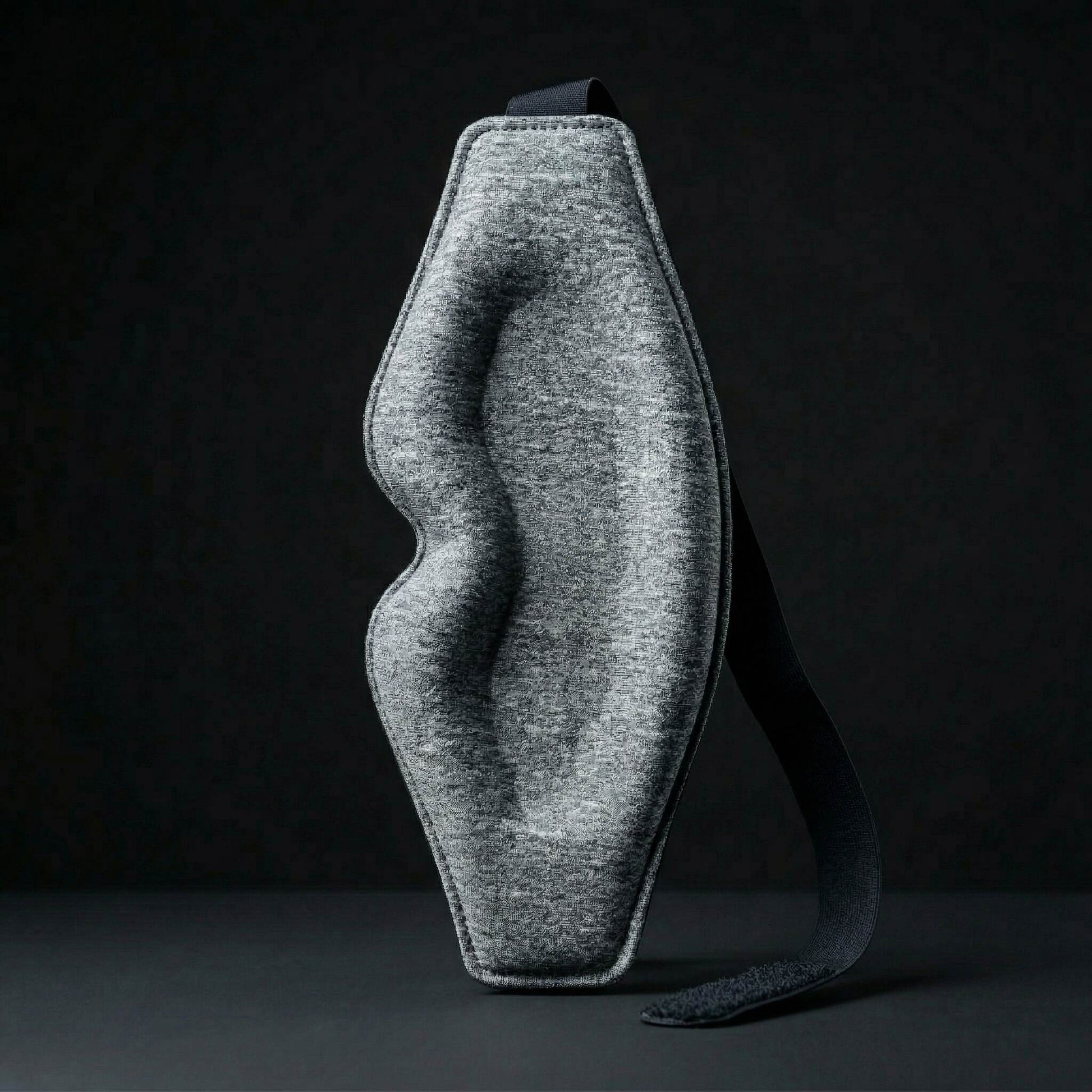 Gray eye mask on a black background